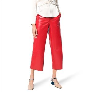 Nanushka high-waist flared vegan leather trousers